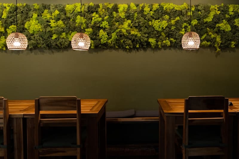 Restaurant dining area — moss strip with pendant lights