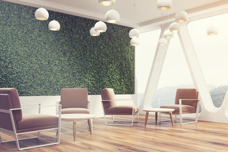 White lounge — living green wall with panoramic windows